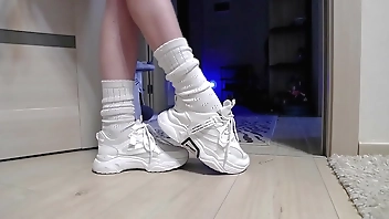 Delicate legs in sneakers are waiting for you!