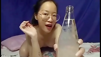 Cute girl drinking water at home