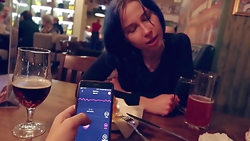 I took control of my stepsister's vibrator in the bar and brought her to orgasm.