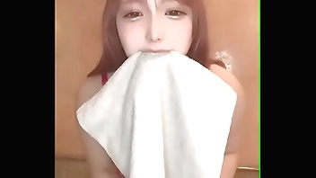 Changing into a uniform. Be careful not to lick your pants.