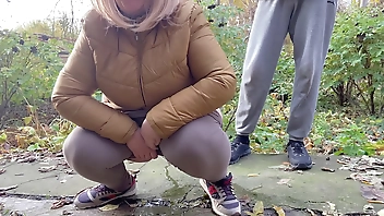 Depraved curvy MILF in leggings squats down and pisses next to me