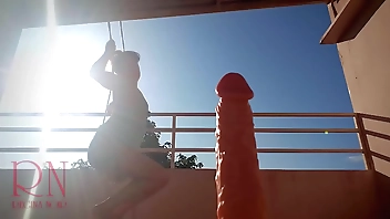 Goddess Regina Noir sucks a huge dildo and pay with tits. Outdoor. Close-up. Big cunt.