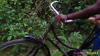 Local girl on a bicycle not knowing how to fix the fault. Taken inside the bush by a man who assisted her fix it and got romance in the process