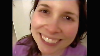 Busty Brunette gets naked and on her knees to suck dick until he blows all over her tits